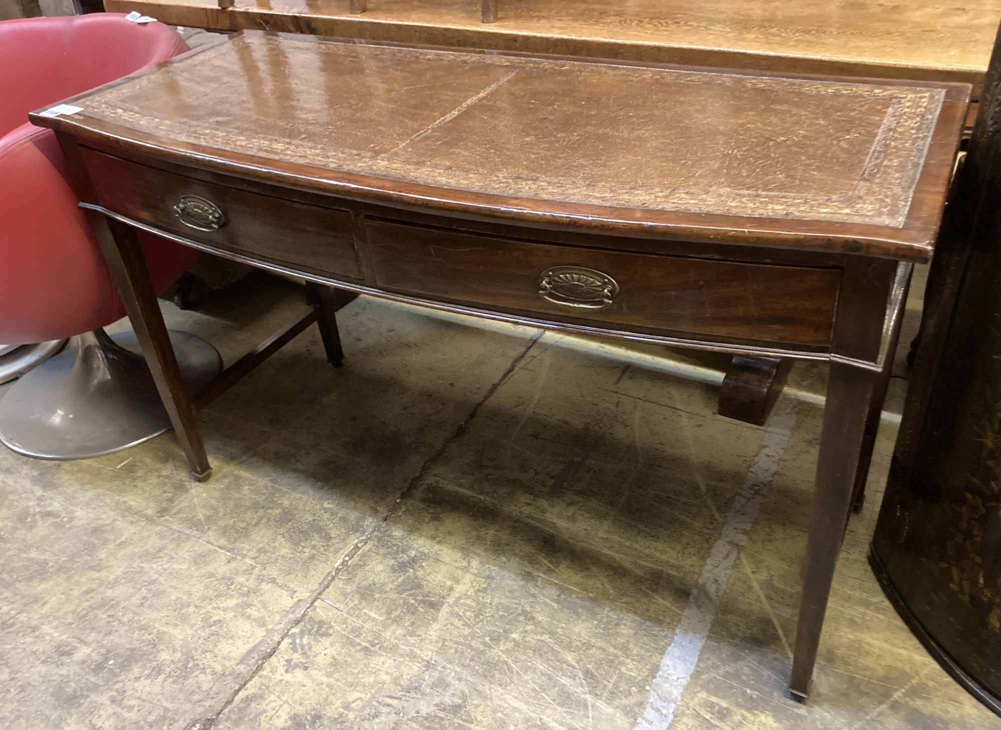 A George III style mahogany bow front writing table, width 123cm, depth 50cm, 74cm